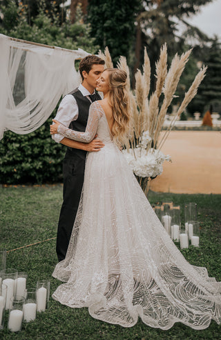 woman holding bouquet in wedding dress